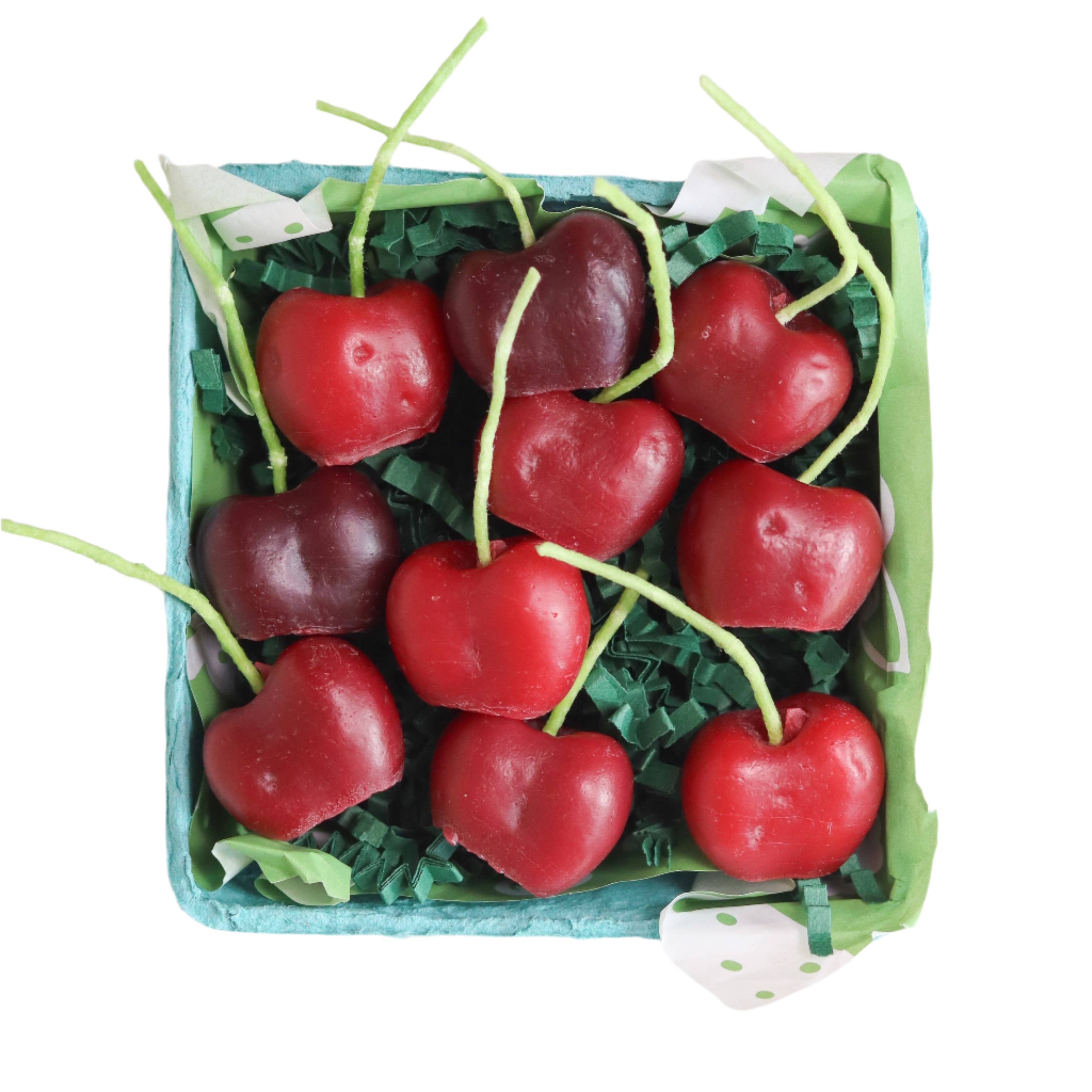 Dark cherry-shaped beeswax birthday candles in rustic berry basket gift box